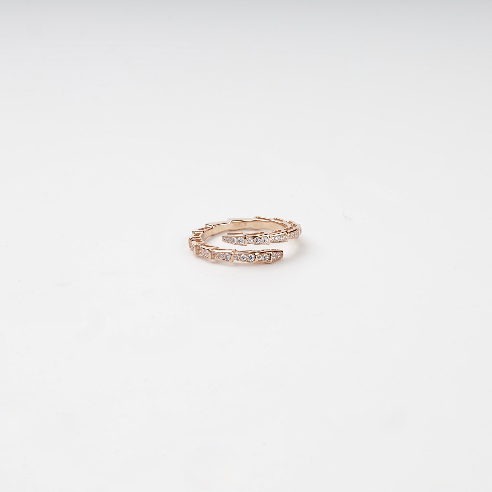 Cubic zirconia segmented wrap ring, angled view — Kabluchka