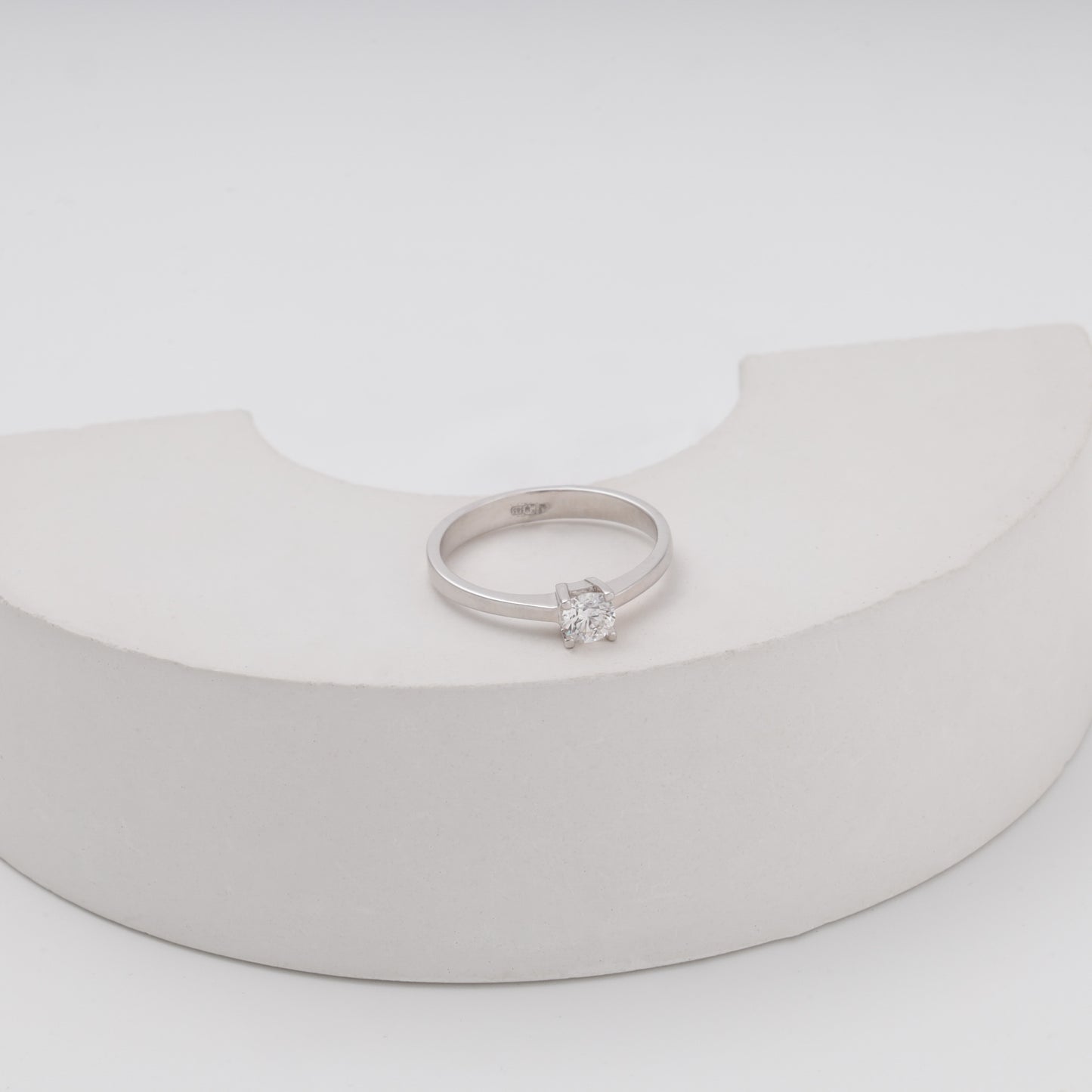 Diamond solitaire ring on crescent prop showing sparkle - Kabluchka store