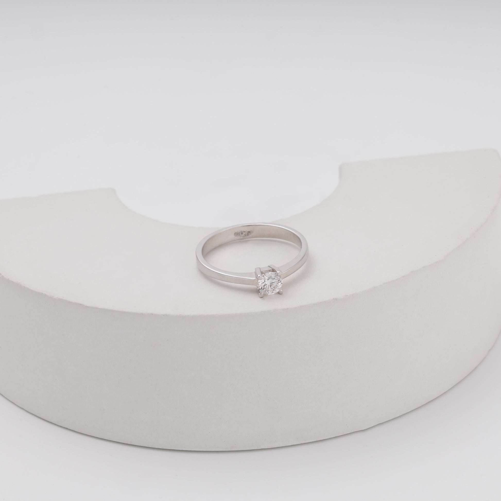 Diamond solitaire ring on crescent prop showing sparkle - Kabluchka store