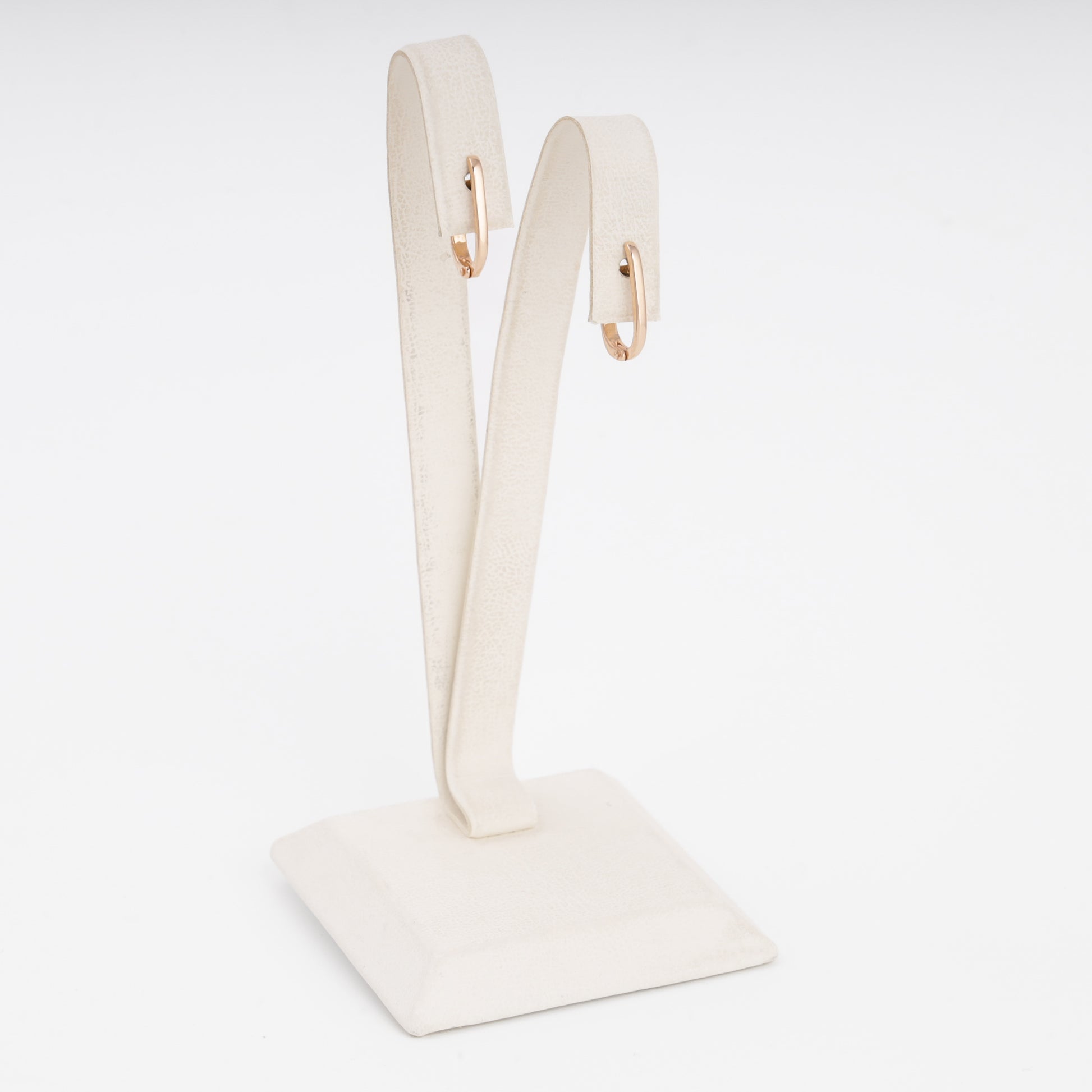 14k gold small hoop earrings on a white stand, minimalist everyday hoops, Ukrainian Jewelry for women.