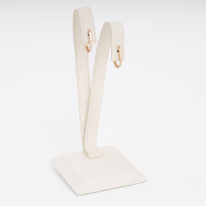 14k gold small hoop earrings on a white stand, minimalist everyday hoops, Ukrainian Jewelry for women.